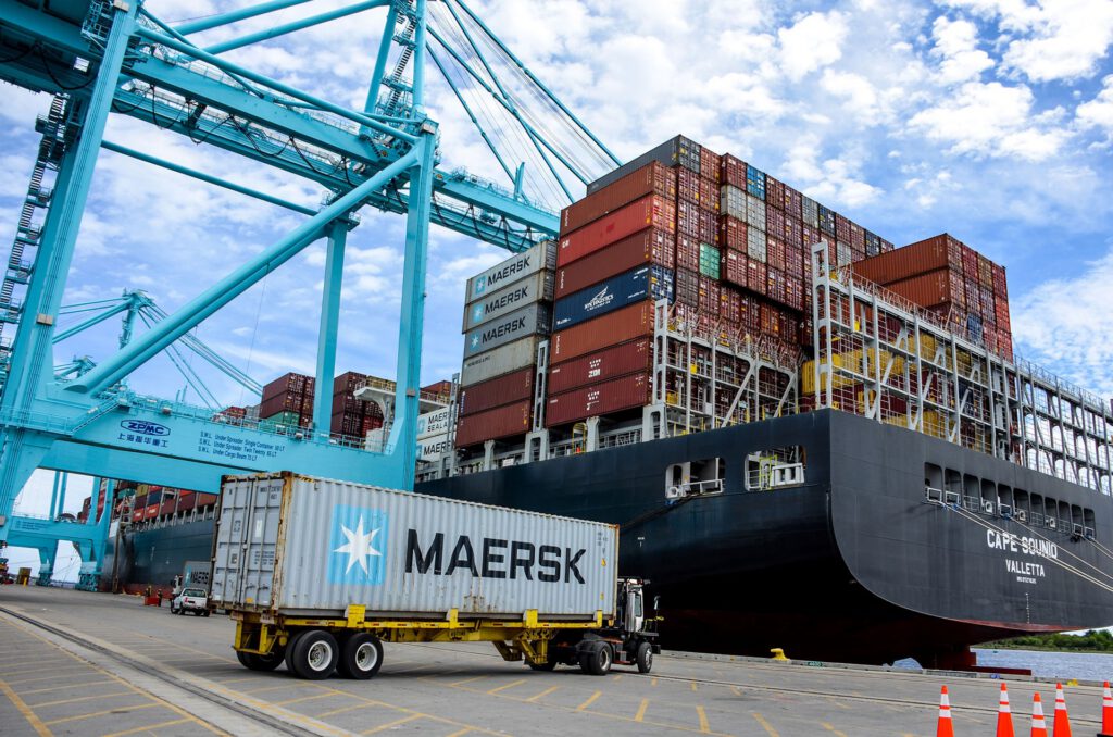 Shipping containers are stacked in a Jacksonville port.