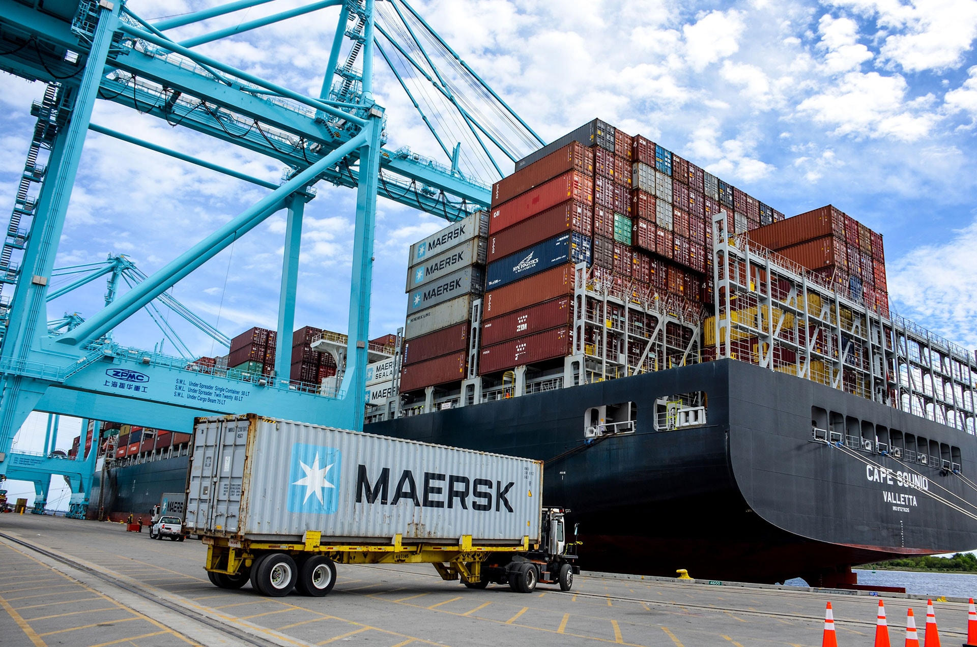 Shipping containers are stacked in a Jacksonville port.